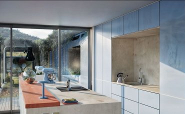 Detailansicht der Küche mit natürlichen Materialien, hellen Fronten und Sichtbeziehung zur Terrasse.